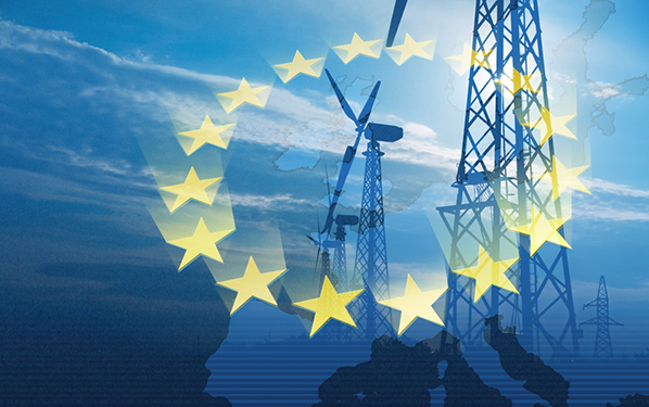 Les étoiles du drapeau de l'Union européenne superposées sur une carte de l'Europe superposée sur un paysage d'éoliennes.